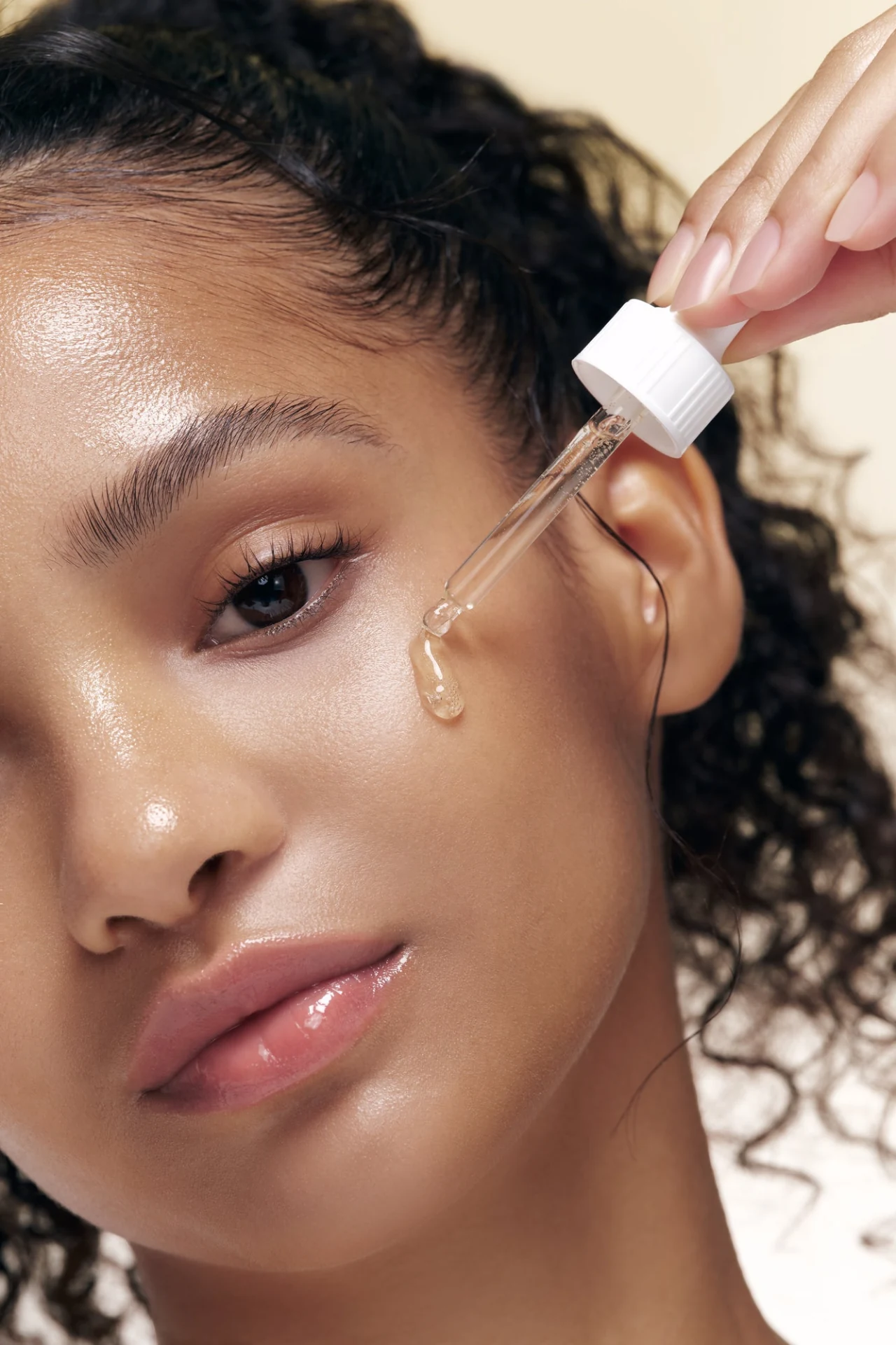 Beauty of Joseon editorial portrait with a serum dropper at the cheek